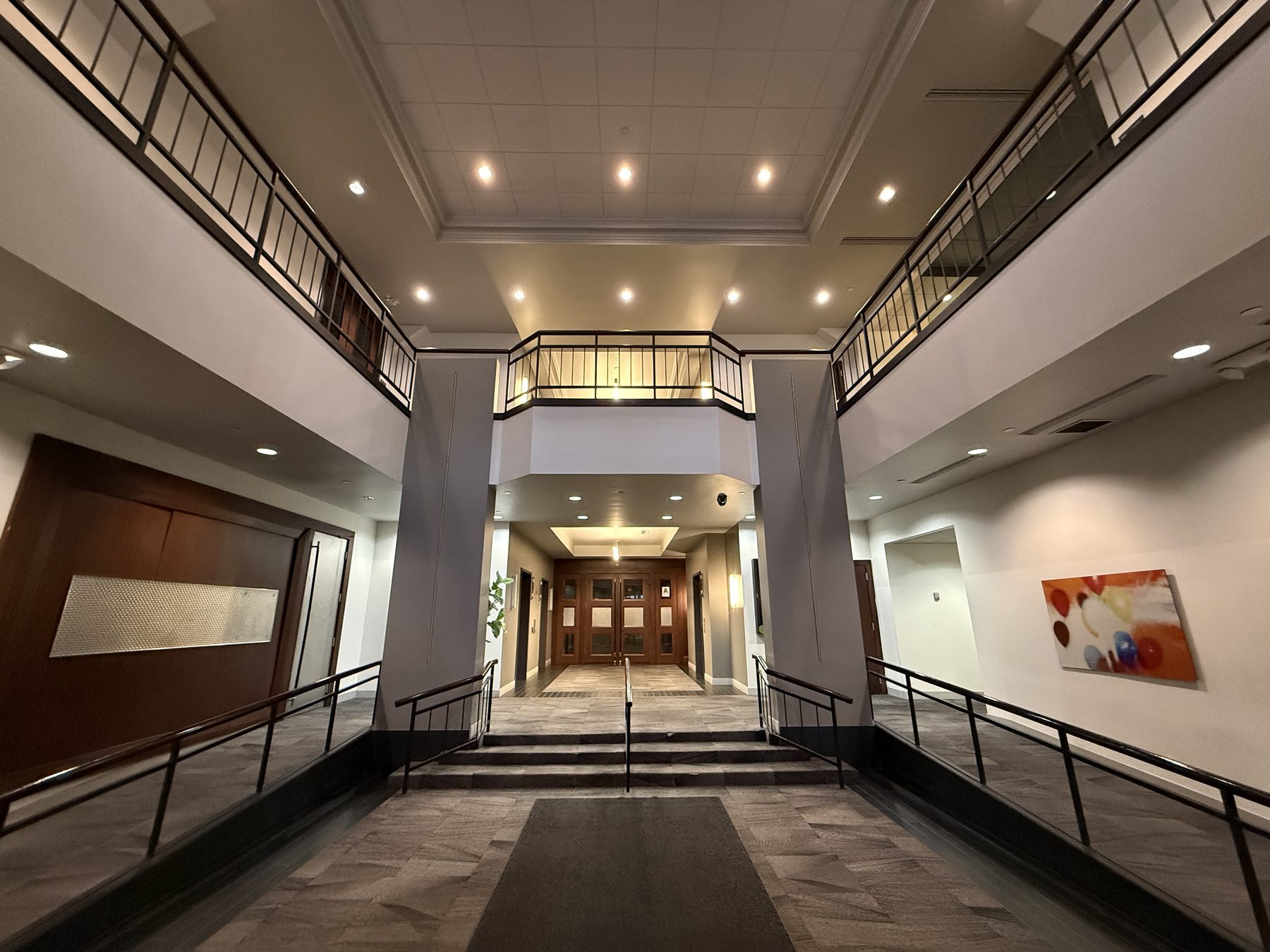 Riverfront Plaza atrium with balconies and artwork